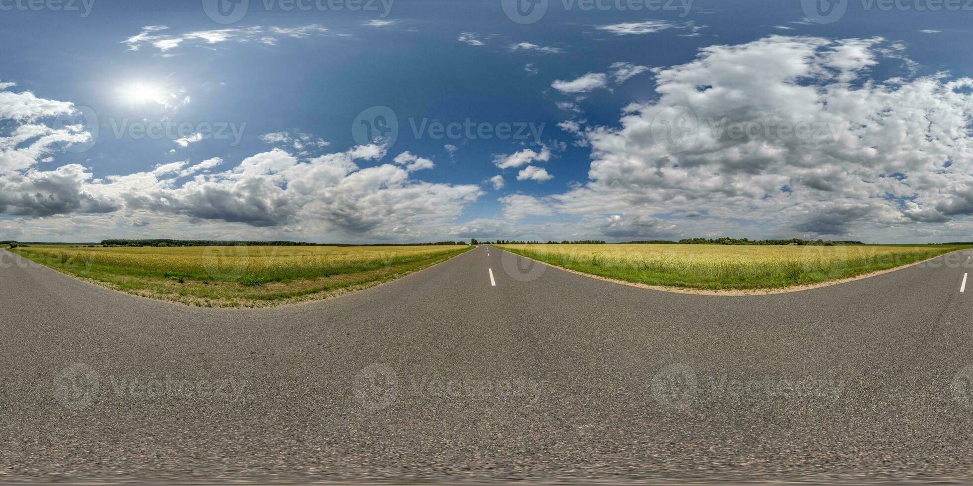 spherical 360 hdri panorama on old asphalt road with clouds and sun on blue sky in equirectangular seamless projection, as skydome replacement in drone panoramas, game development photo