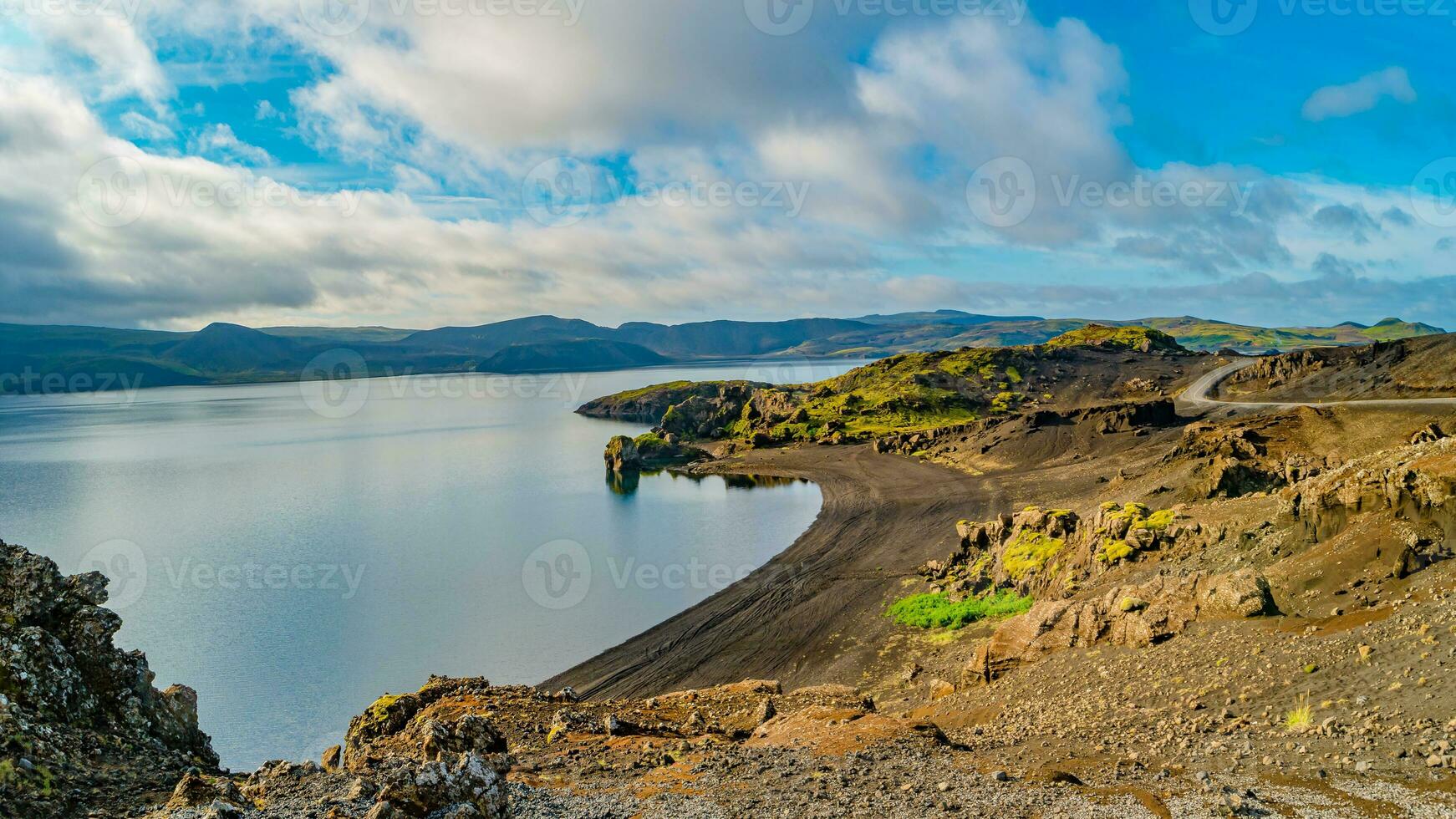 Panoramic over Icelandic colorful and wild landscape with volcanic black sand beach at the Kleifarvatn lake at summer time, Iceland photo