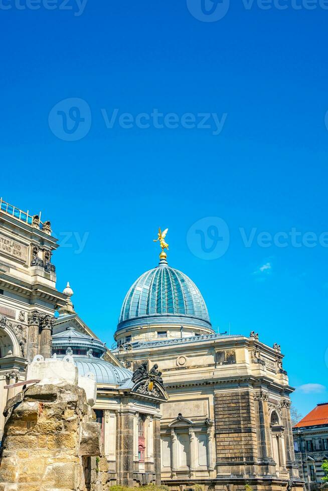 Main building of the Zitronenpresse facade and Dome with statues of golden angels as warriors and defenders in historical downtown of Dresden, Germany photo