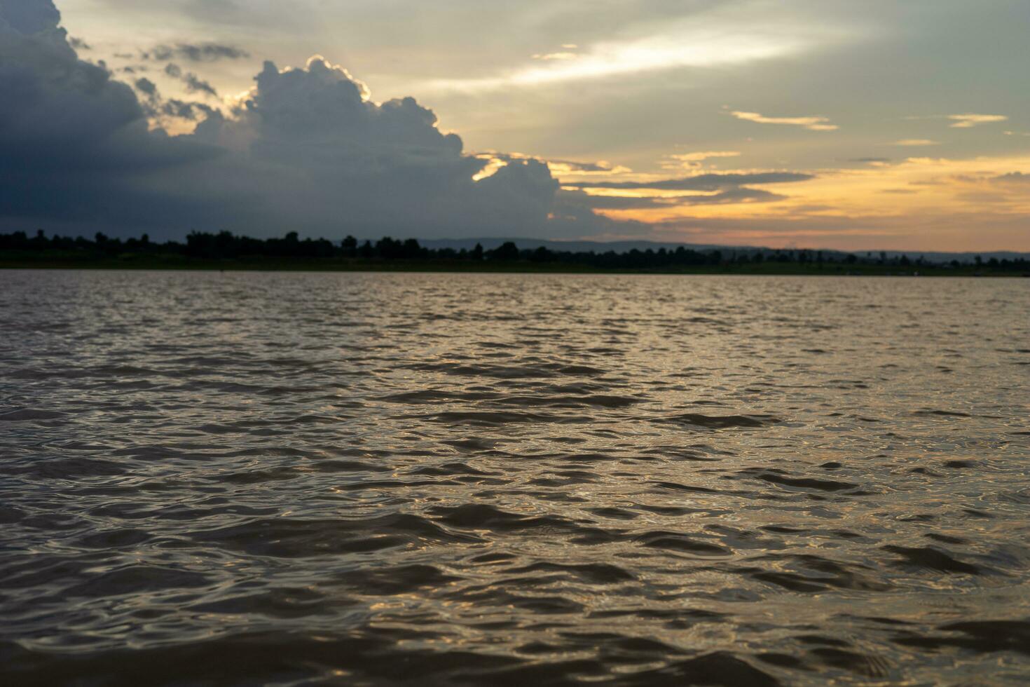 Sunset over the river in the evening photo