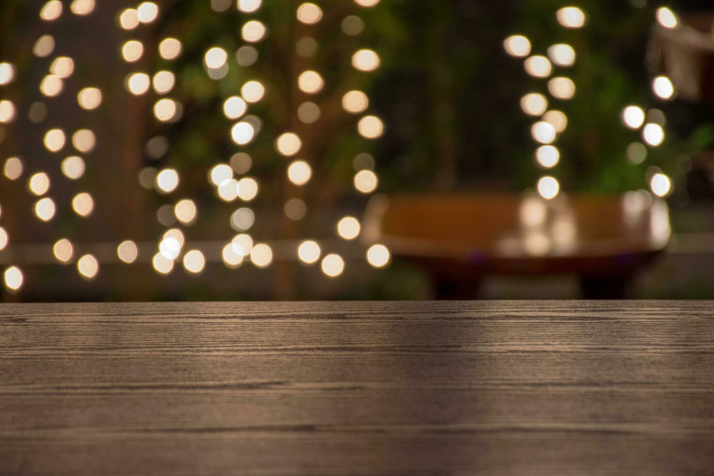 Image of wooden table in front of abstract blurred background. photo