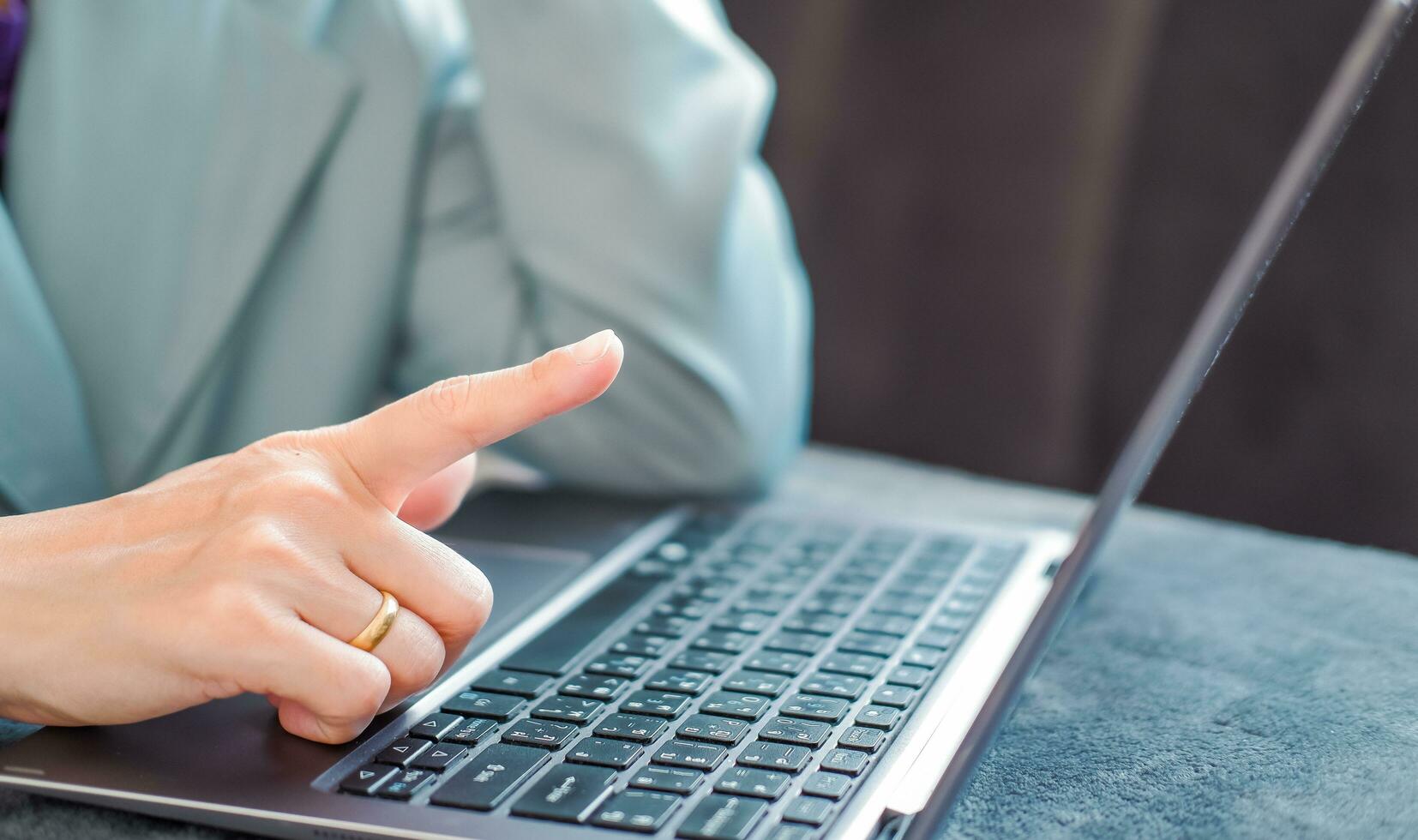 Woman typing work on laptop Suitable for making infographics. photo