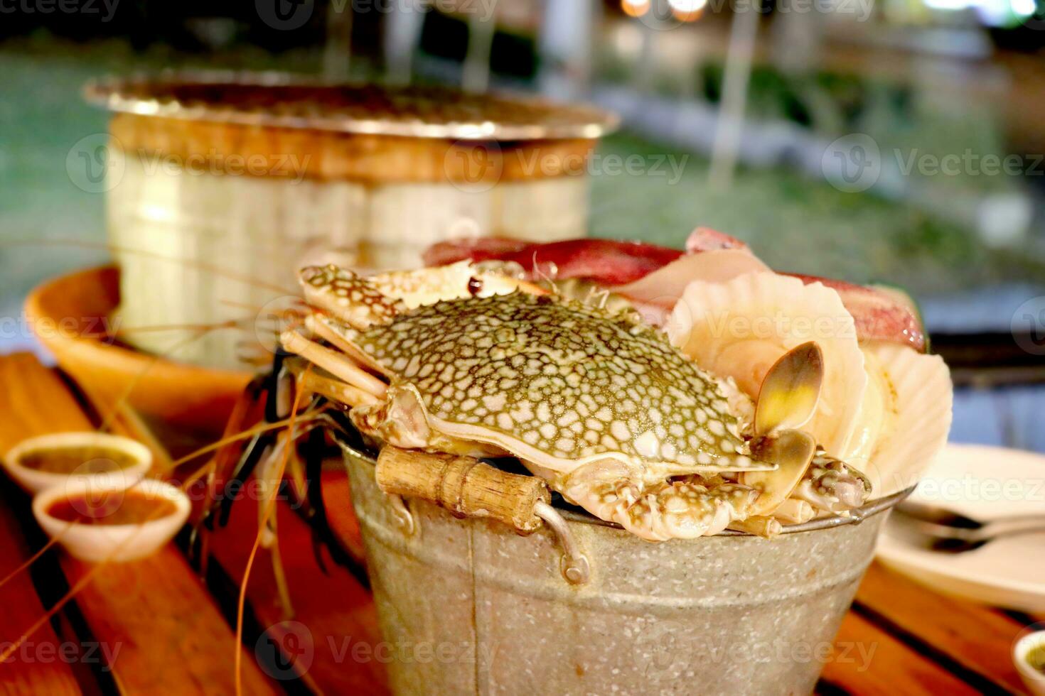 Fresh seafood in zinc tank such as crab, octopus, and shell for preparing the grilling in the restaurant photo