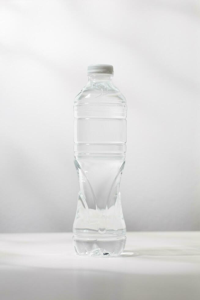 Bottled water on a white table. photo