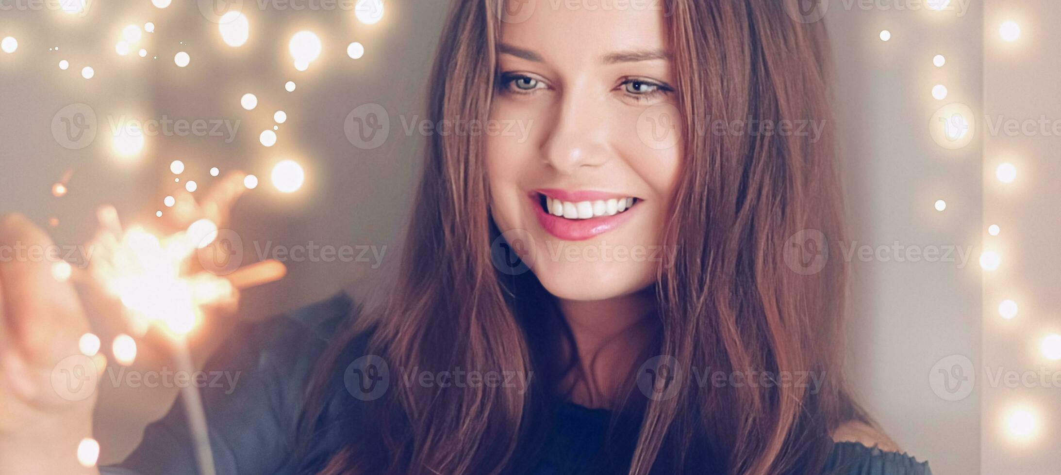 Holiday magic, Christmas and New Year celebration, happy woman with sparklers photo