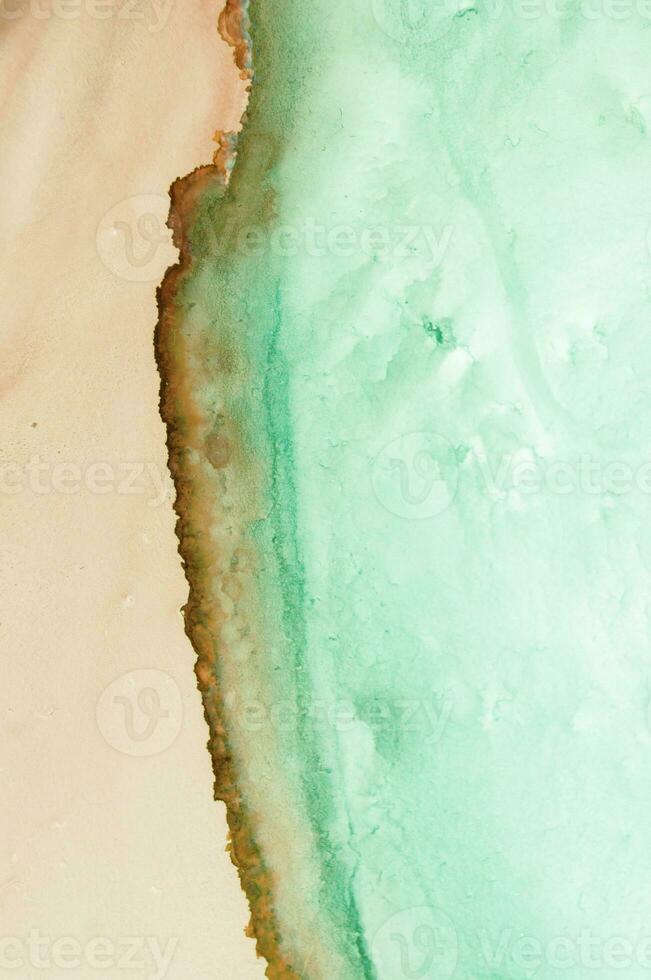 Alcohol ink. Style incorporates the swirls of marble or the ripples of agate. Abstract painting, can be used as a trendy background for wallpapers, posters, cards, invitations, websites. photo
