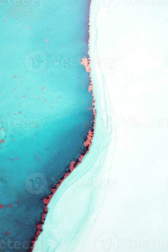 Artistic background that applicable for design cover, poster, brochure. Modern art. Marble texture. Natural pattern. Ink colors are amazingly bright. Alcohol ink sea texture. Contemporary art. photo