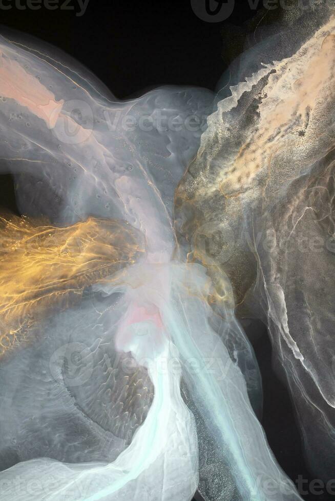 Alcohol ink on the black background. Alcohol ink colors translucent. Design wrapping paper, wallpaper. Modern fluid art. Multicolored marble texture background. Colorful luxury texture. photo