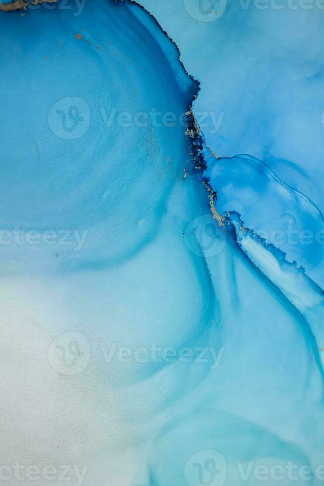 Painting created with alcohol ink. Soft smooth color transitions combined with clear gold and silver edges. Blue, pink, green abstract color combination. photo