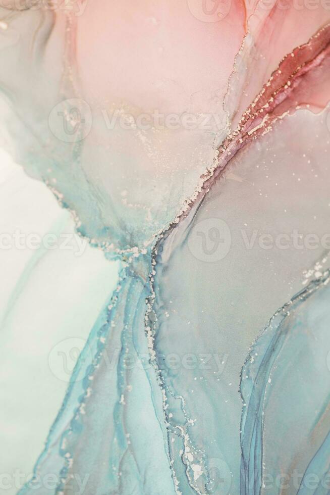 Painting created with alcohol ink. Soft smooth color transitions combined with clear gold and silver edges. Blue, pink, green abstract color combination. photo