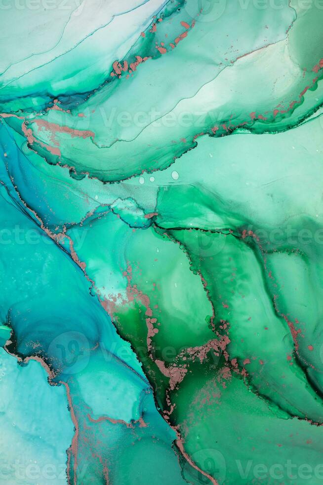 Painting created with alcohol ink. Soft smooth color transitions combined with clear gold and silver edges. Blue, pink, green abstract color combination. photo