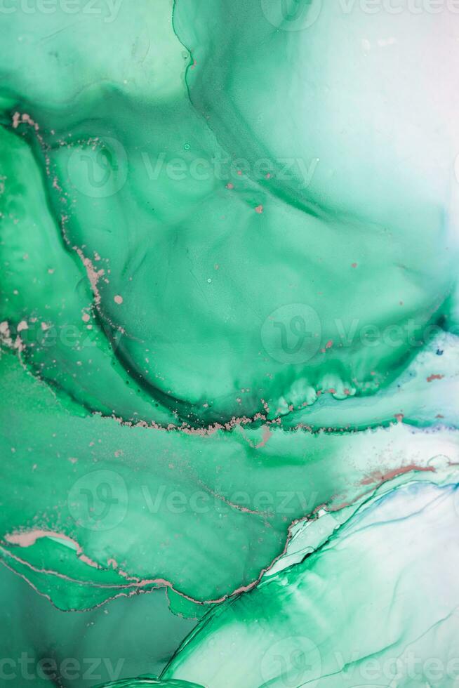 Painting created with alcohol ink. Soft smooth color transitions combined with clear gold and silver edges. Blue, pink, green abstract color combination. photo