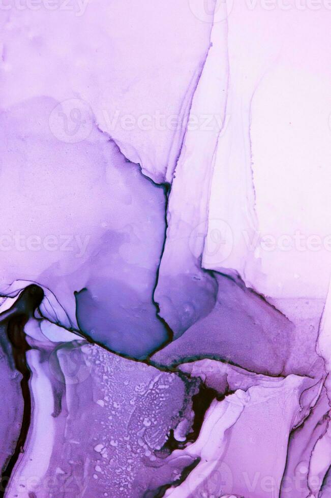 Abstract created using the technique of Alcohol ink. Macro photography of the smallest details of a panting. The panting shows how overflows of shades and colors of paint resemble space motifs. photo