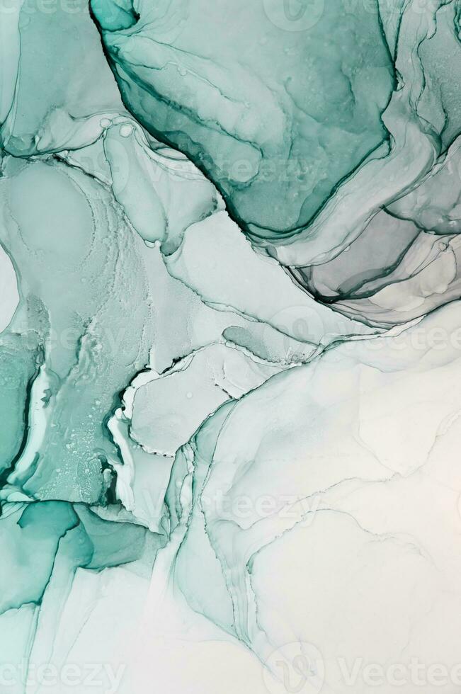 Abstract created using the technique of Alcohol ink. Macro photography of the smallest details of a panting. The panting shows how overflows of shades and colors of paint resemble space motifs. photo