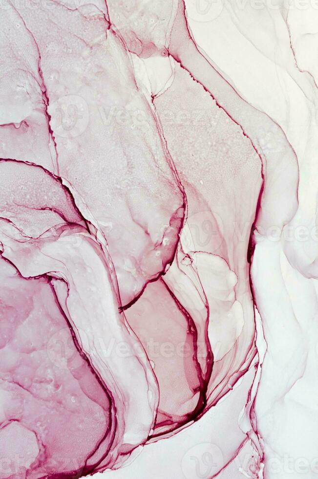 Abstract created using the technique of Alcohol ink. Macro photography of the smallest details of a panting. The panting shows how overflows of shades and colors of paint resemble space motifs. photo