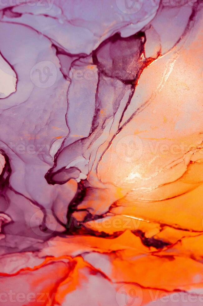 Abstract created using the technique of Alcohol ink. Macro photography of the smallest details of a panting. The panting shows how overflows of shades and colors of paint resemble space motifs. photo