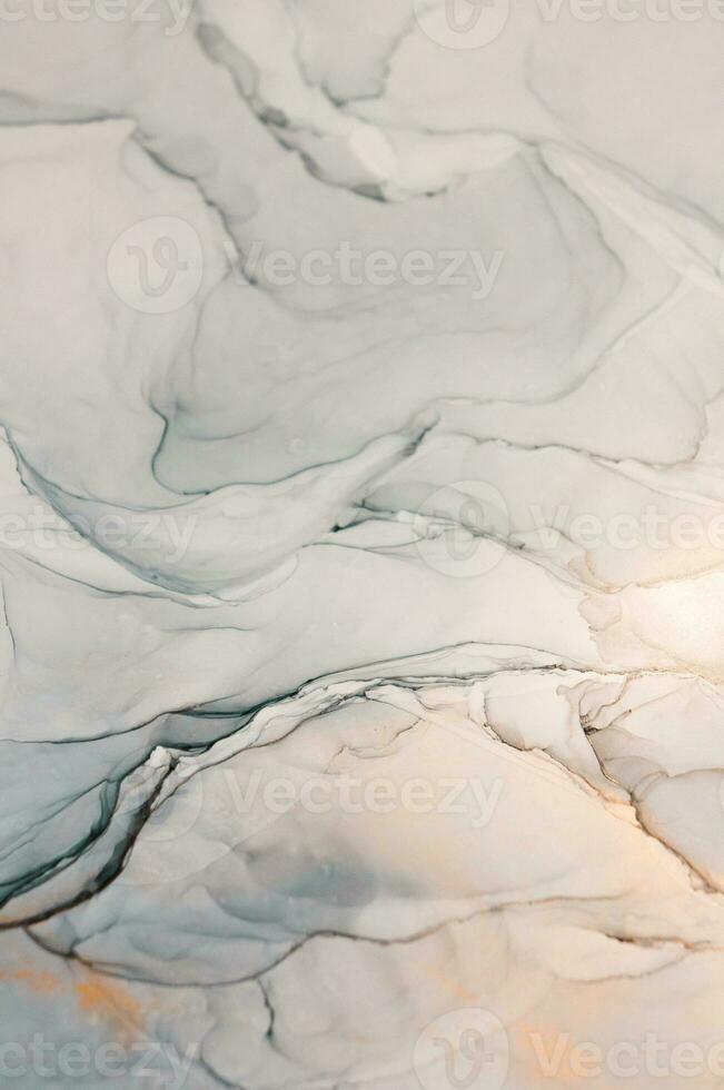 The picture is painted in alcohol ink. Creative abstract artwork made with translucent ink colors. Trendy wallpaper. Abstract painting, can be used as a background for wallpapers, posters, websites. photo