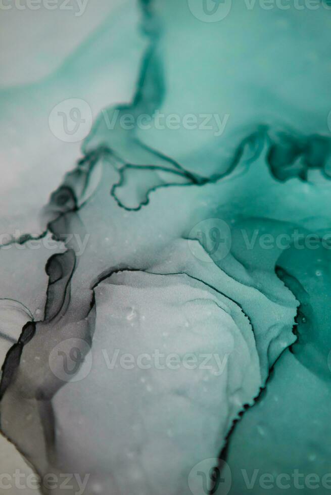 Alcohol ink sea texture. Artistic bright splash. Liquid artwork. Abstract ethereal swirl. Fragment of artwork. Trendy modern art. Inspired by the sky, as well as steam and smoke. photo