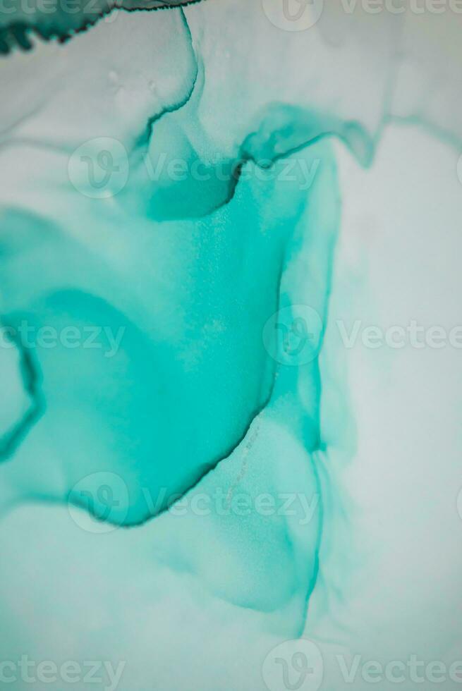 Alcohol ink sea texture. Artistic bright splash. Liquid artwork. Abstract ethereal swirl. Fragment of artwork. Trendy modern art. Inspired by the sky, as well as steam and smoke. photo