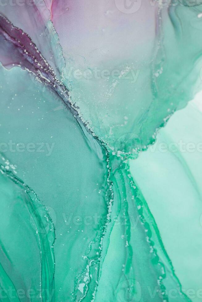 Painting created with alcohol ink. Soft smooth color transitions combined with clear gold and silver edges. Blue, pink, green abstract color combination. photo