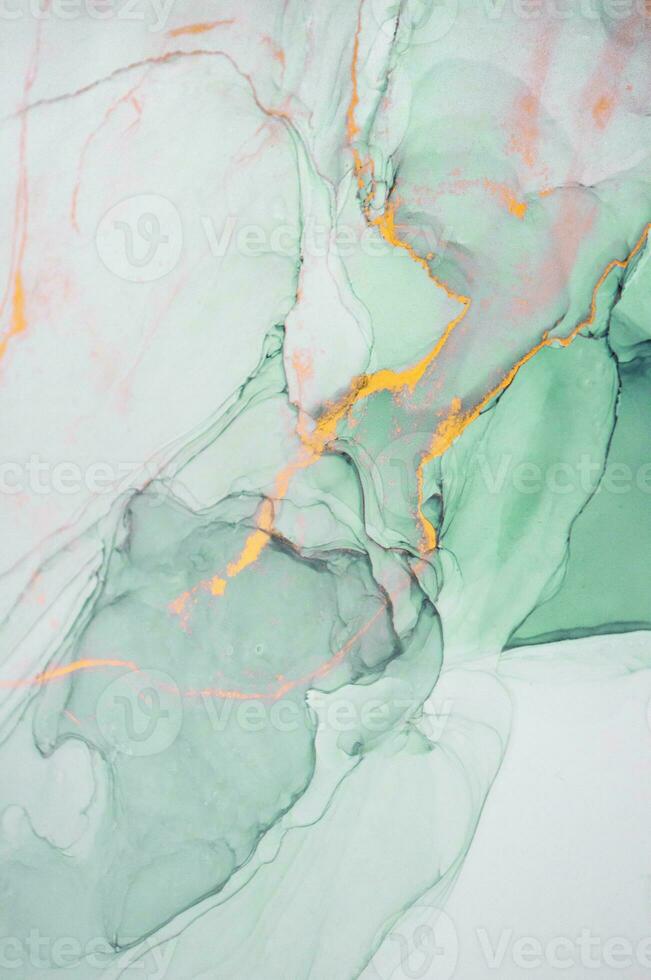 The picture is painted in alcohol ink. Creative abstract artwork made with translucent ink colors. Trendy wallpaper. Abstract painting, can be used as a background for wallpapers, posters, websites. photo