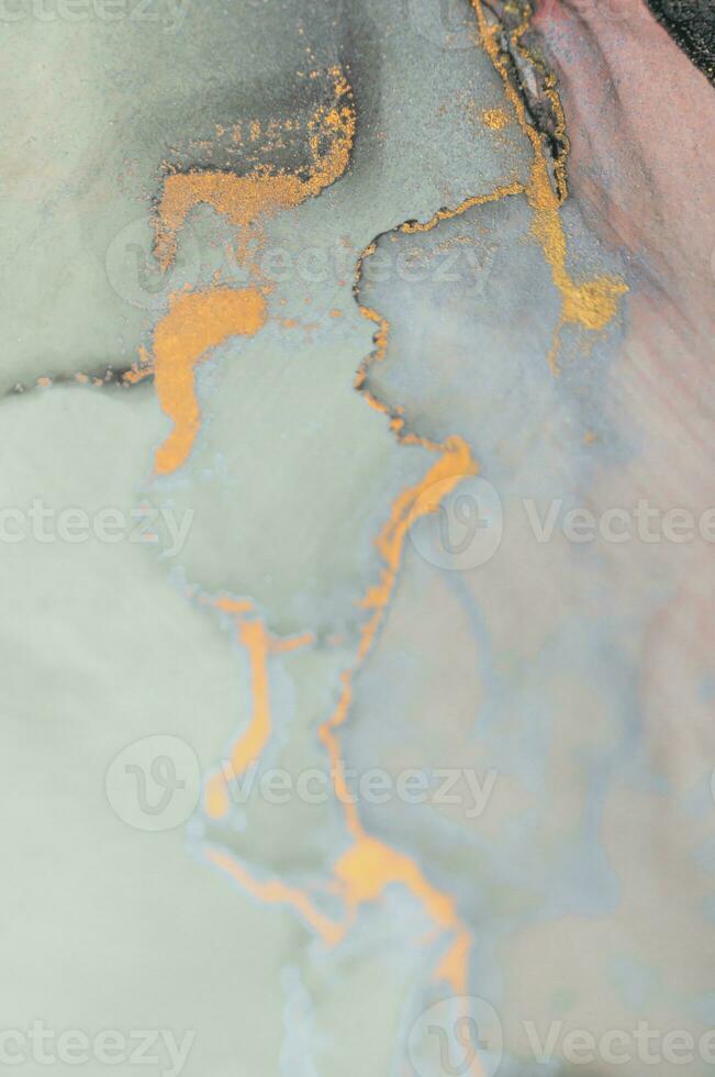 Alcohol ink wash texture on white paper background. Liquid paint flow. Transparent ethereal effect. Closeup of the painting. Highly-textured colorful abstract painting background. photo