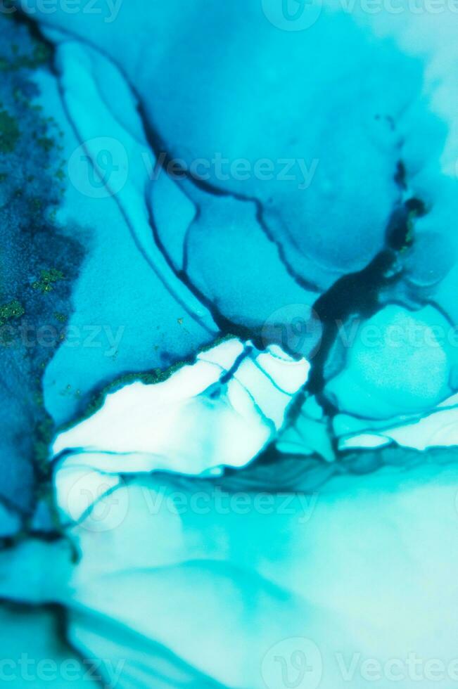 The picture is painted in alcohol ink. Abstraction will perfectly fit into a modern interior. Closeup of the painting. Colorful abstract painting background. photo