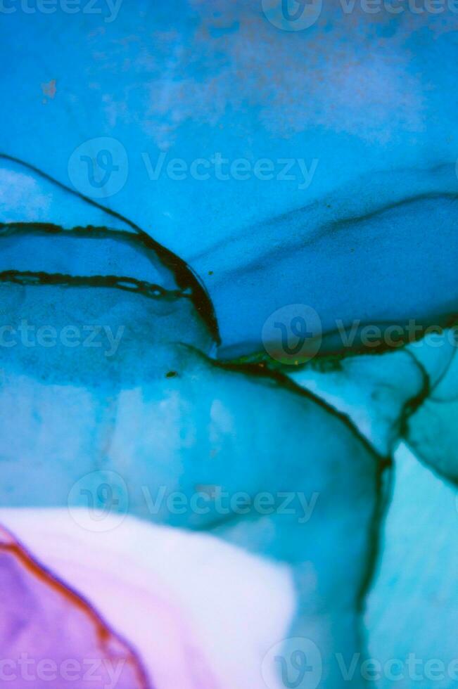 The picture is painted in alcohol ink. Abstraction will perfectly fit into a modern interior. Closeup of the painting. Colorful abstract painting background. photo