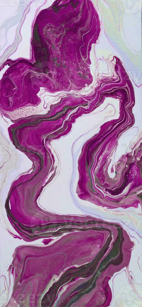 Abstract created using the technique of liquid acrylic. Macro photography of the smallest details of a picture. The picture shows how overflows of shades and colors of paint resemble space motifs. photo