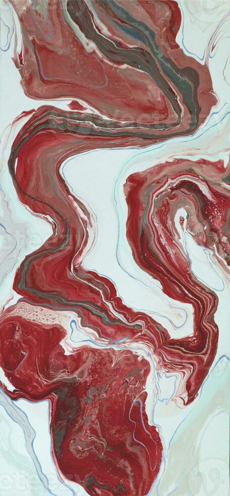 Abstract created using the technique of liquid acrylic. Macro photography of the smallest details of a picture. The picture shows how overflows of shades and colors of paint resemble space motifs. photo