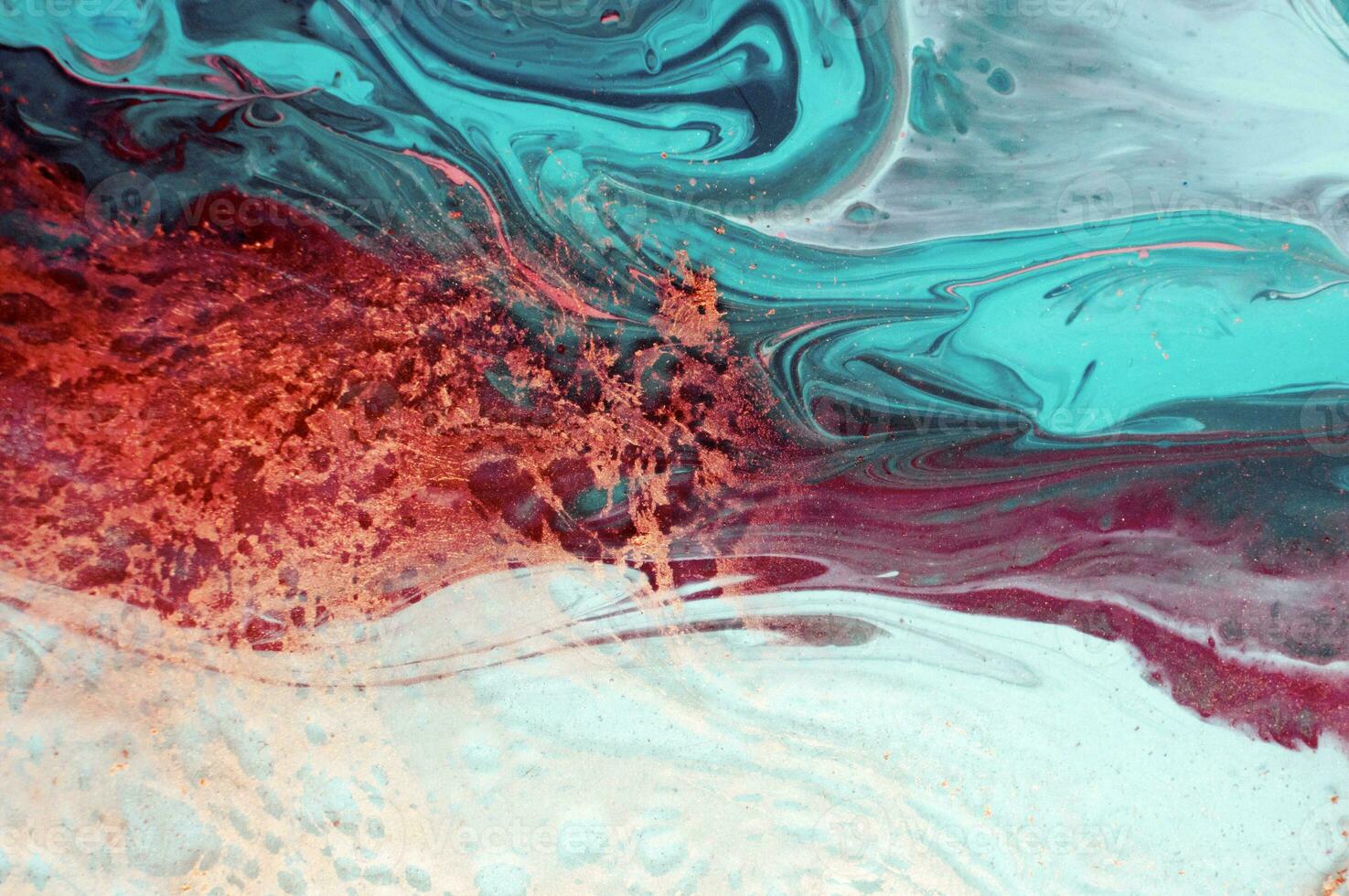 Abstract created using the technique of liquid acrylic. Macro photography of the smallest details of a panting. The panting shows how overflows of shades and colors of paint resemble space motifs. photo