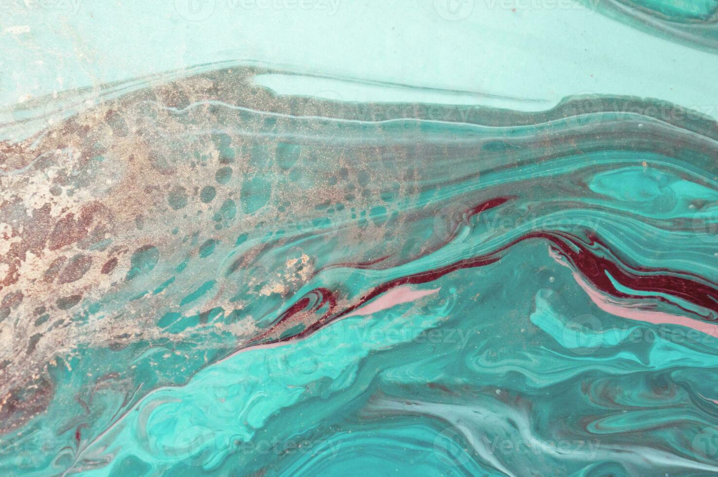 Abstract created using the technique of liquid acrylic. Macro photography of the smallest details of a panting. The panting shows how overflows of shades and colors of paint resemble space motifs. photo