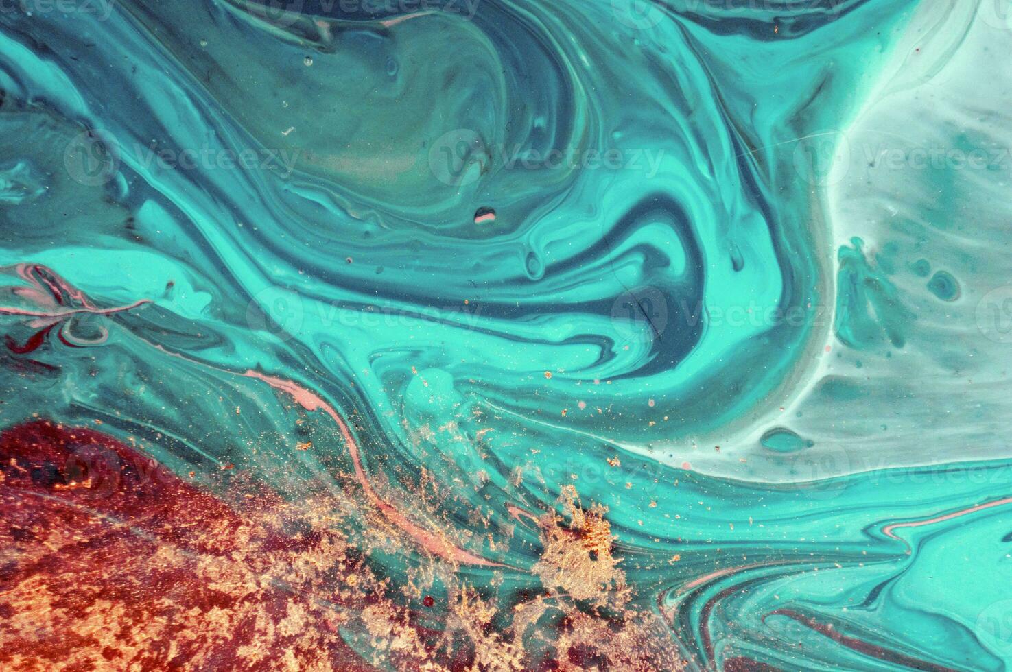 Abstract created using the technique of liquid acrylic. Macro photography of the smallest details of a panting. The panting shows how overflows of shades and colors of paint resemble space motifs. photo