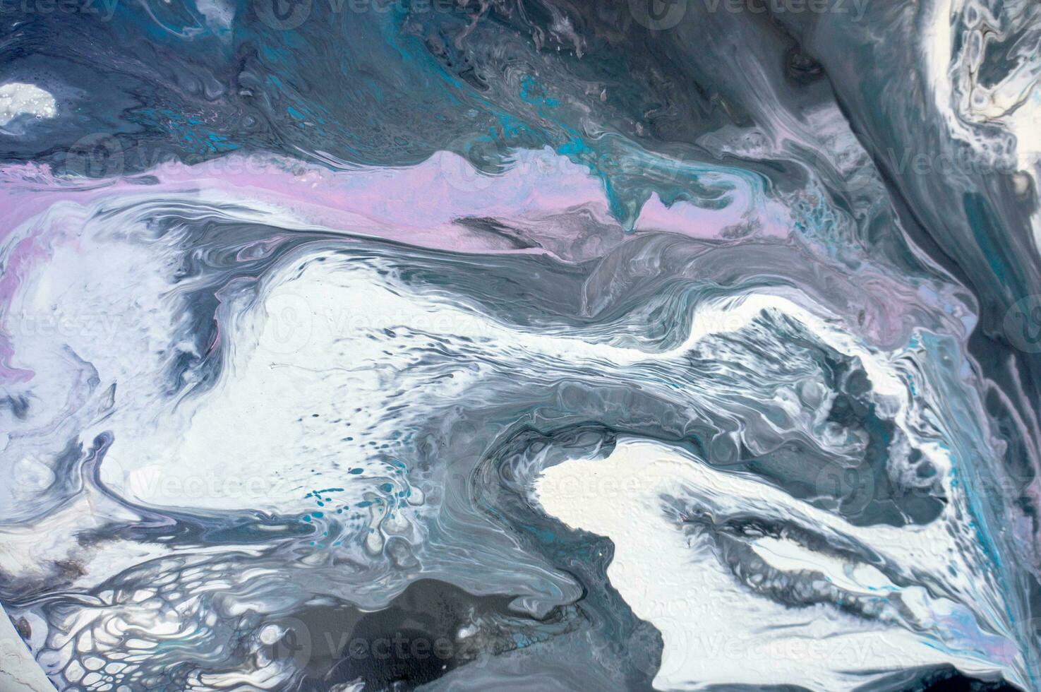 Abstract created using the technique of liquid acrylic. Macro photography of the smallest details of a picture. The picture shows how overflows of shades and colors of paint resemble space motifs. photo