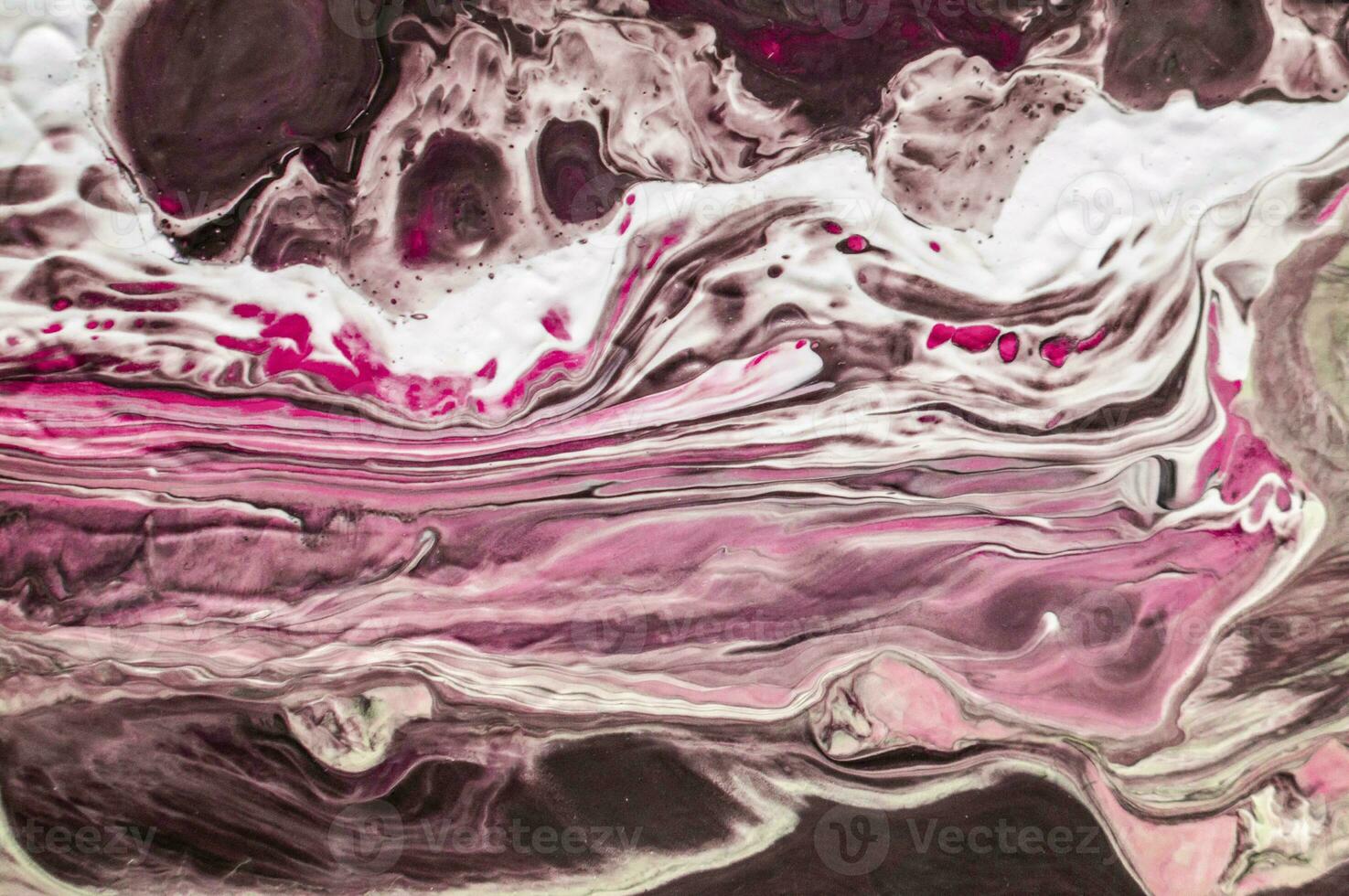 Abstract created using the technique of liquid acrylic. Macro photography of the smallest details of a picture. The picture shows how overflows of shades and colors of paint resemble space motifs. photo