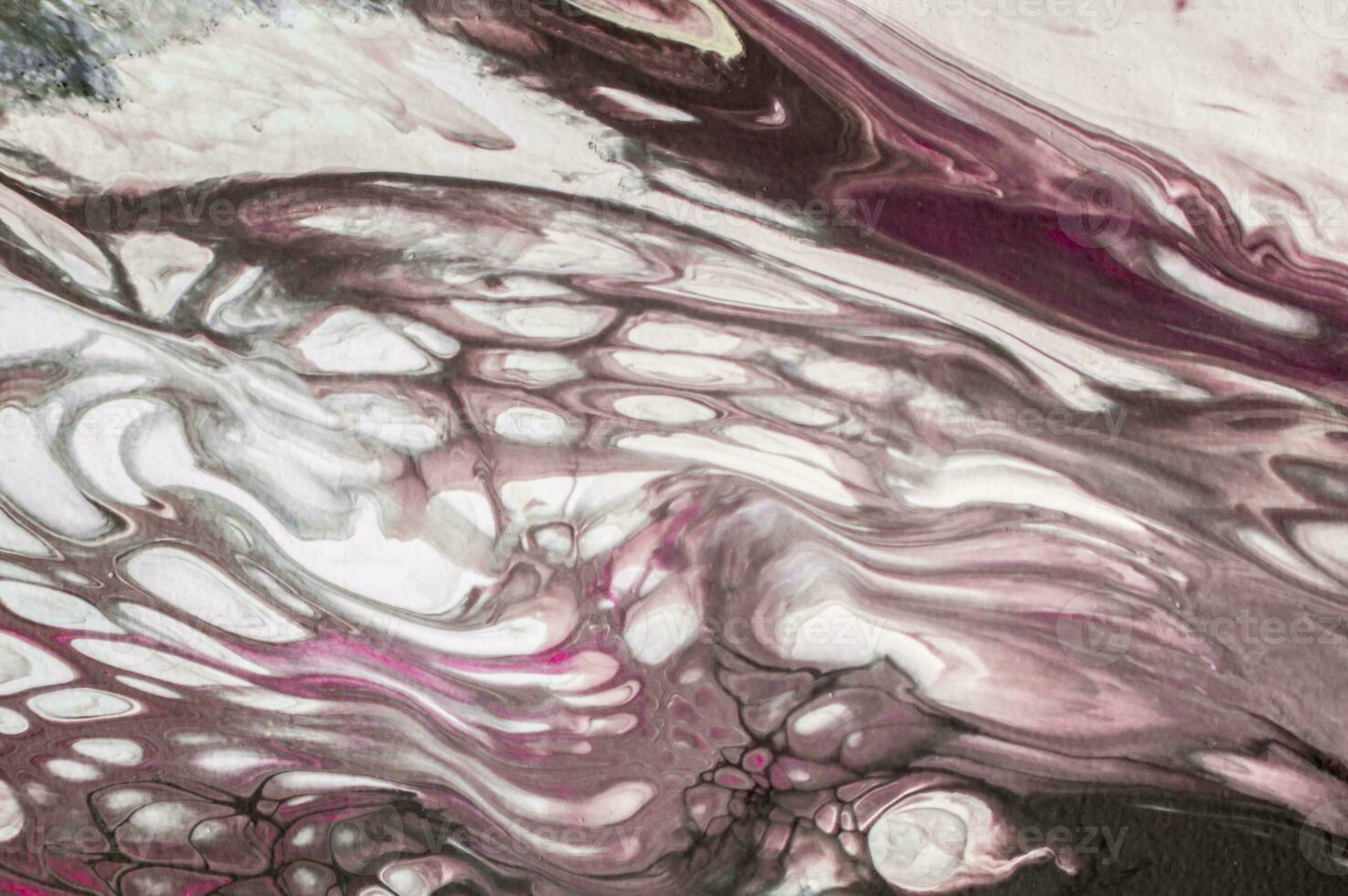 Abstract created using the technique of liquid acrylic. Macro photography of the smallest details of a picture. The picture shows how overflows of shades and colors of paint resemble space motifs. photo