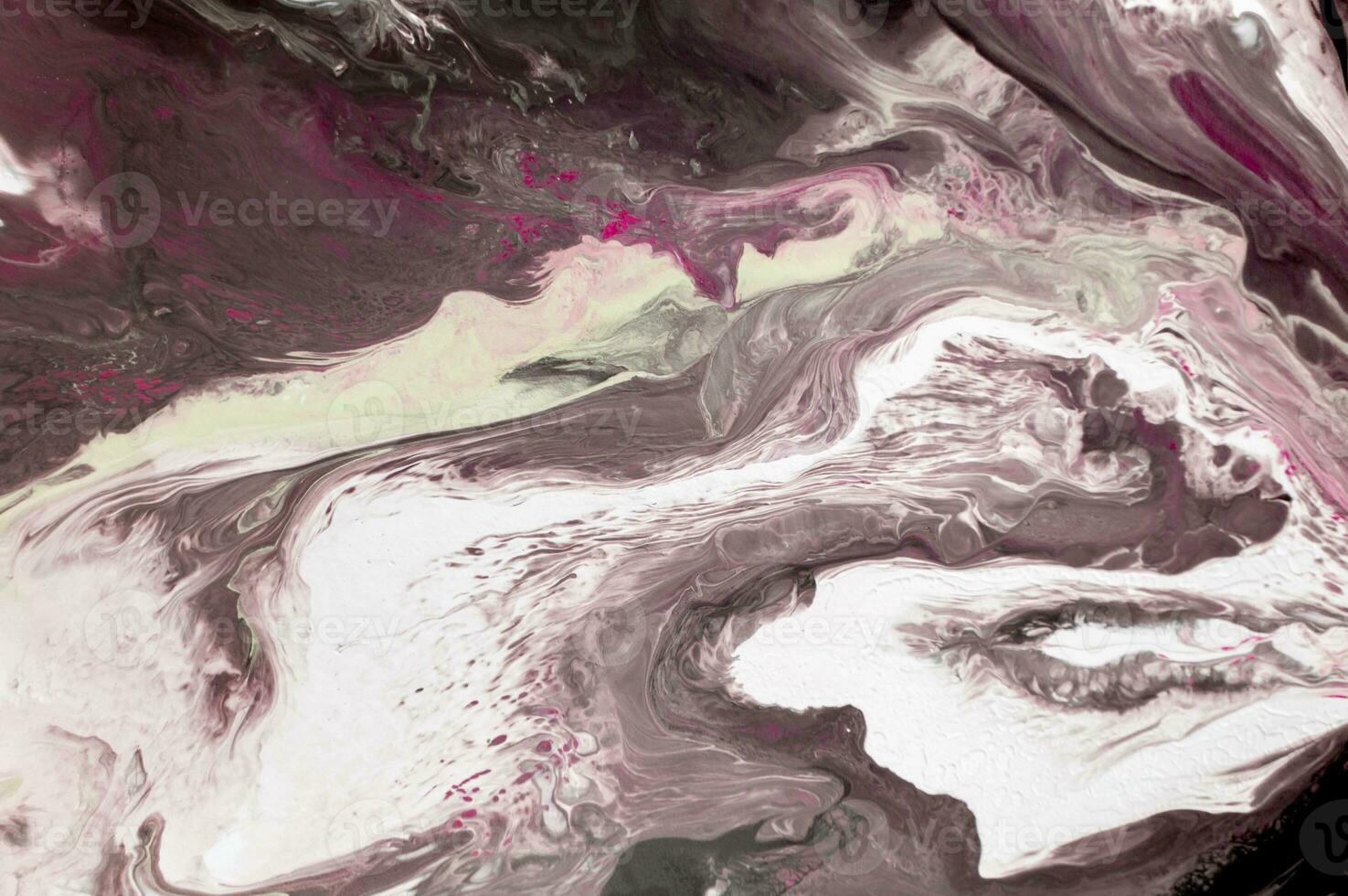 Abstract created using the technique of liquid acrylic. Macro photography of the smallest details of a picture. The picture shows how overflows of shades and colors of paint resemble space motifs. photo