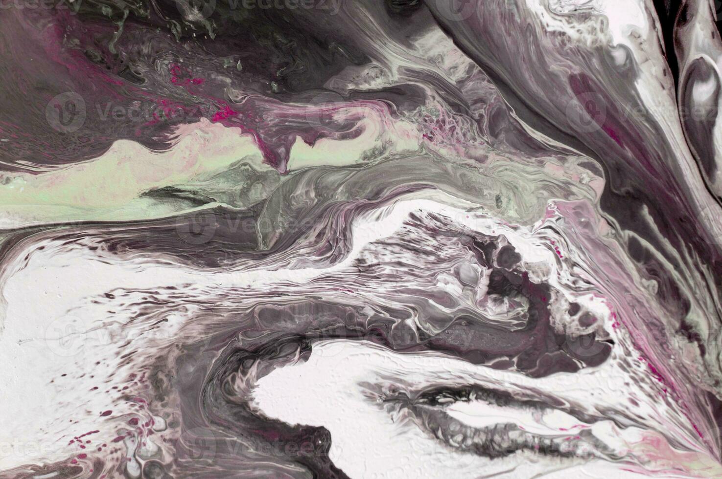 Abstract created using the technique of liquid acrylic. Macro photography of the smallest details of a picture. The picture shows how overflows of shades and colors of paint resemble space motifs. photo