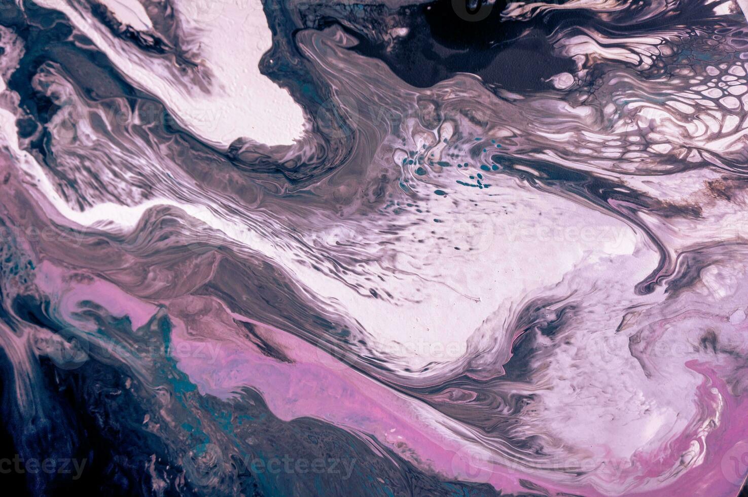 Abstract created using the technique of liquid acrylic. Macro photography of the smallest details of a picture. The picture shows how overflows of shades and colors of paint resemble space motifs. photo