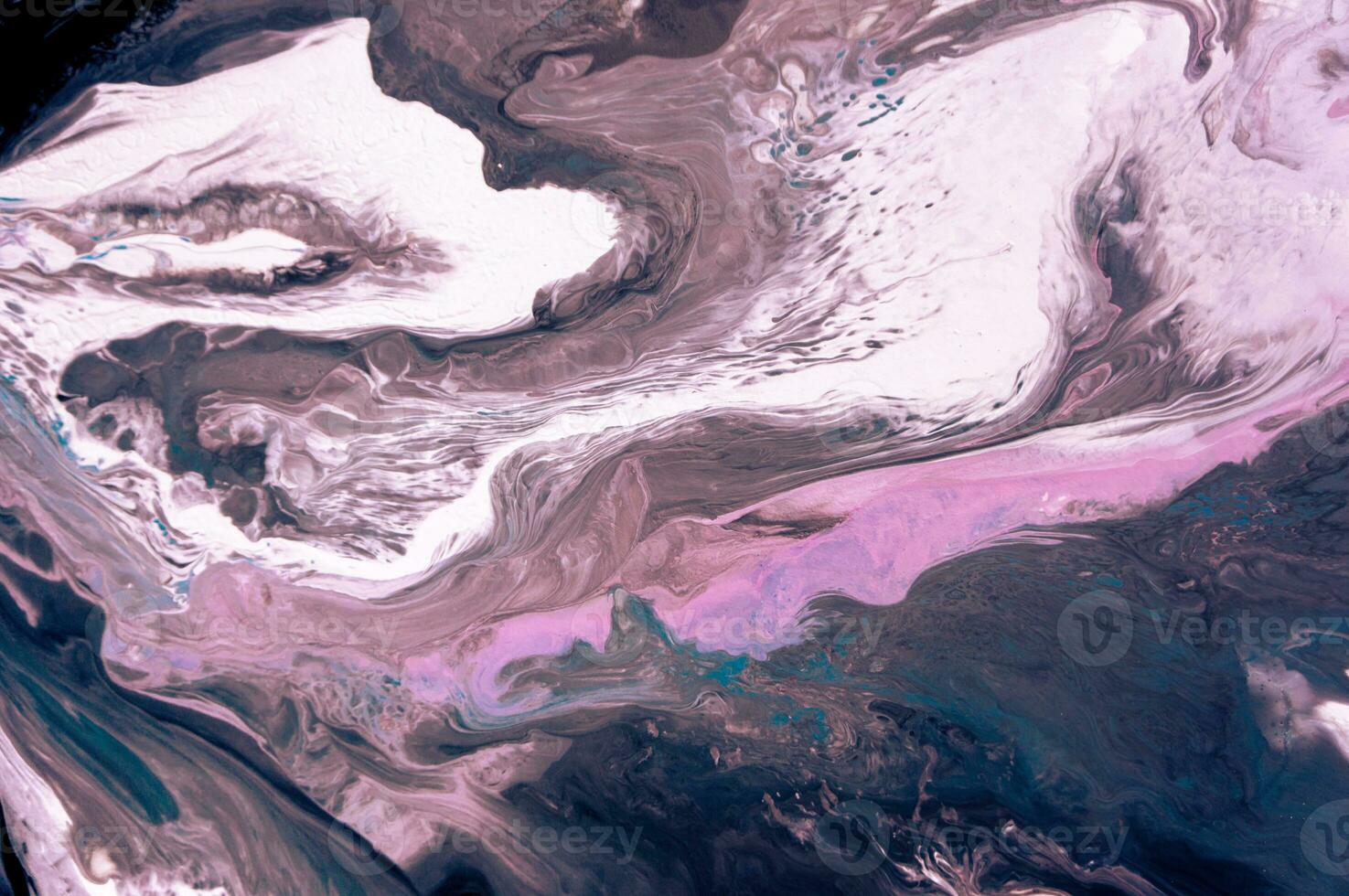 Abstract created using the technique of liquid acrylic. Macro photography of the smallest details of a picture. The picture shows how overflows of shades and colors of paint resemble space motifs. photo