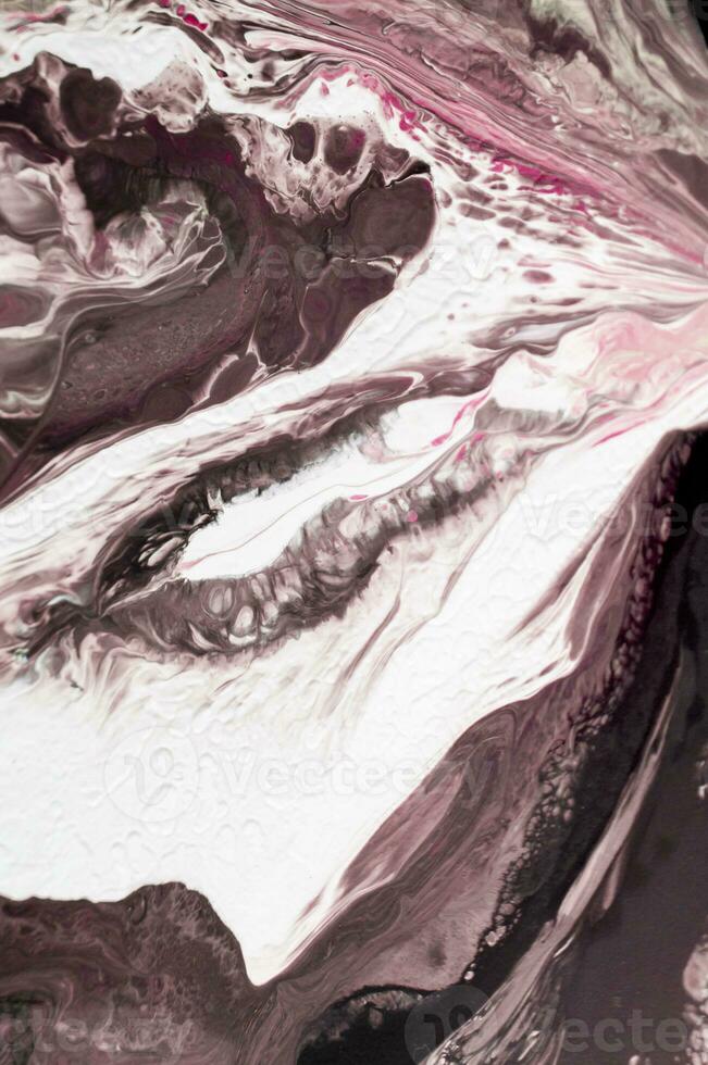 Abstract created using the technique of liquid acrylic. Macro photography of the smallest details of a picture. The picture shows how overflows of shades and colors of paint resemble space motifs. photo