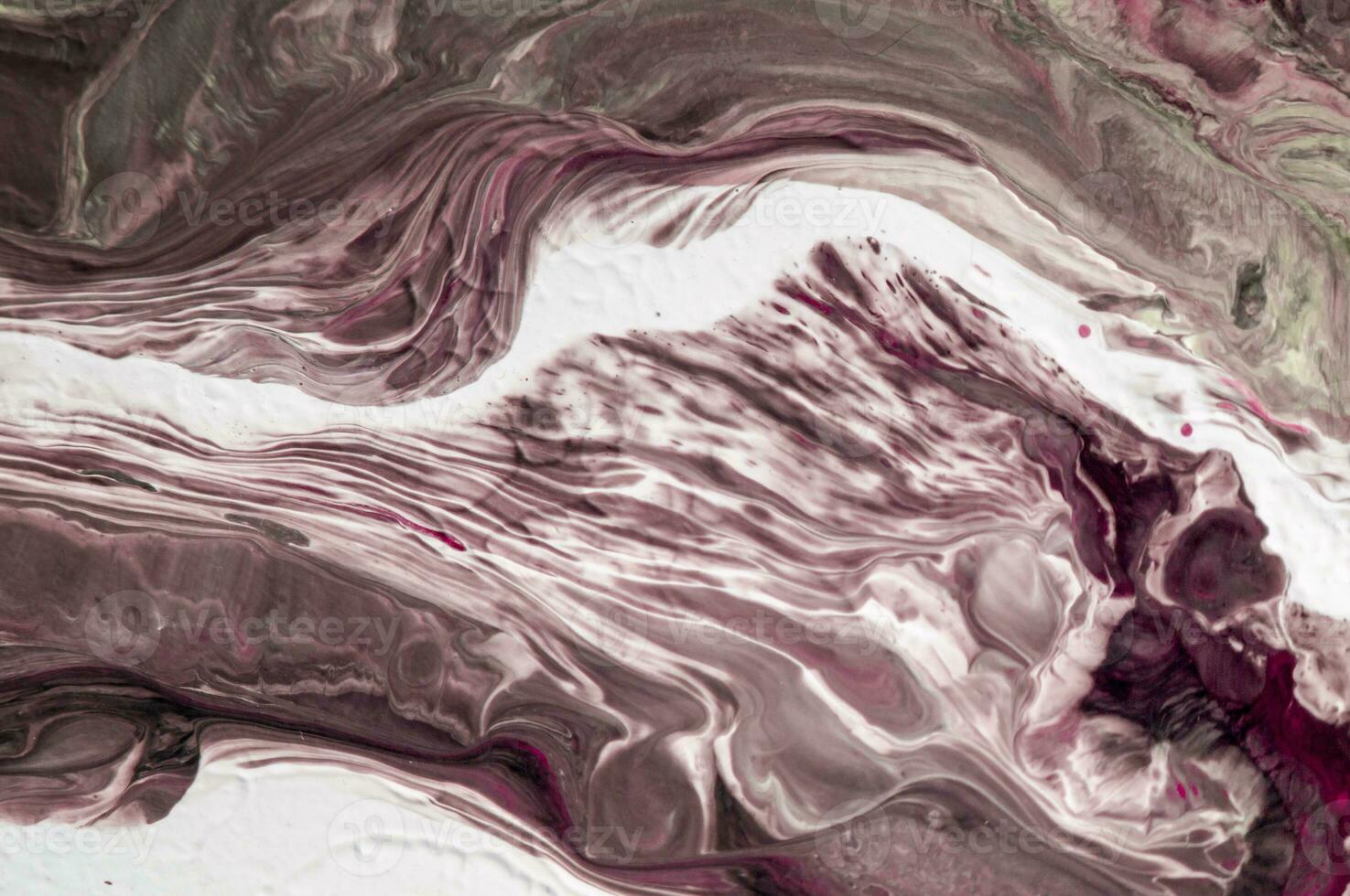 Abstract created using the technique of liquid acrylic. Macro photography of the smallest details of a picture. The picture shows how overflows of shades and colors of paint resemble space motifs. photo