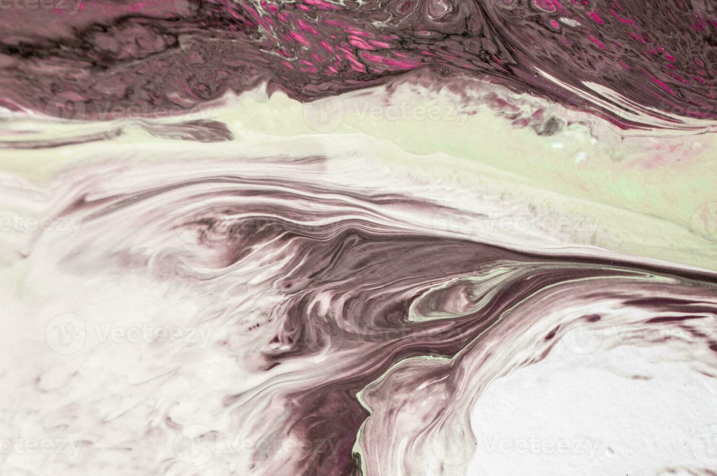 Abstract created using the technique of liquid acrylic. Macro photography of the smallest details of a picture. The picture shows how overflows of shades and colors of paint resemble space motifs. photo