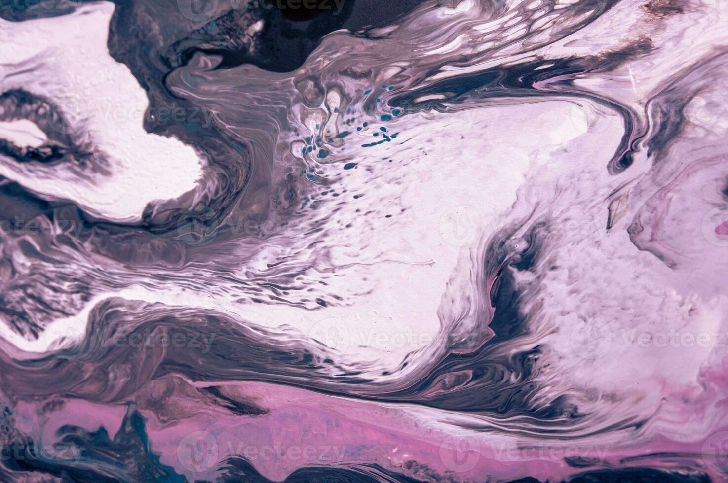 Abstract created using the technique of liquid acrylic. Macro photography of the smallest details of a picture. The picture shows how overflows of shades and colors of paint resemble space motifs. photo