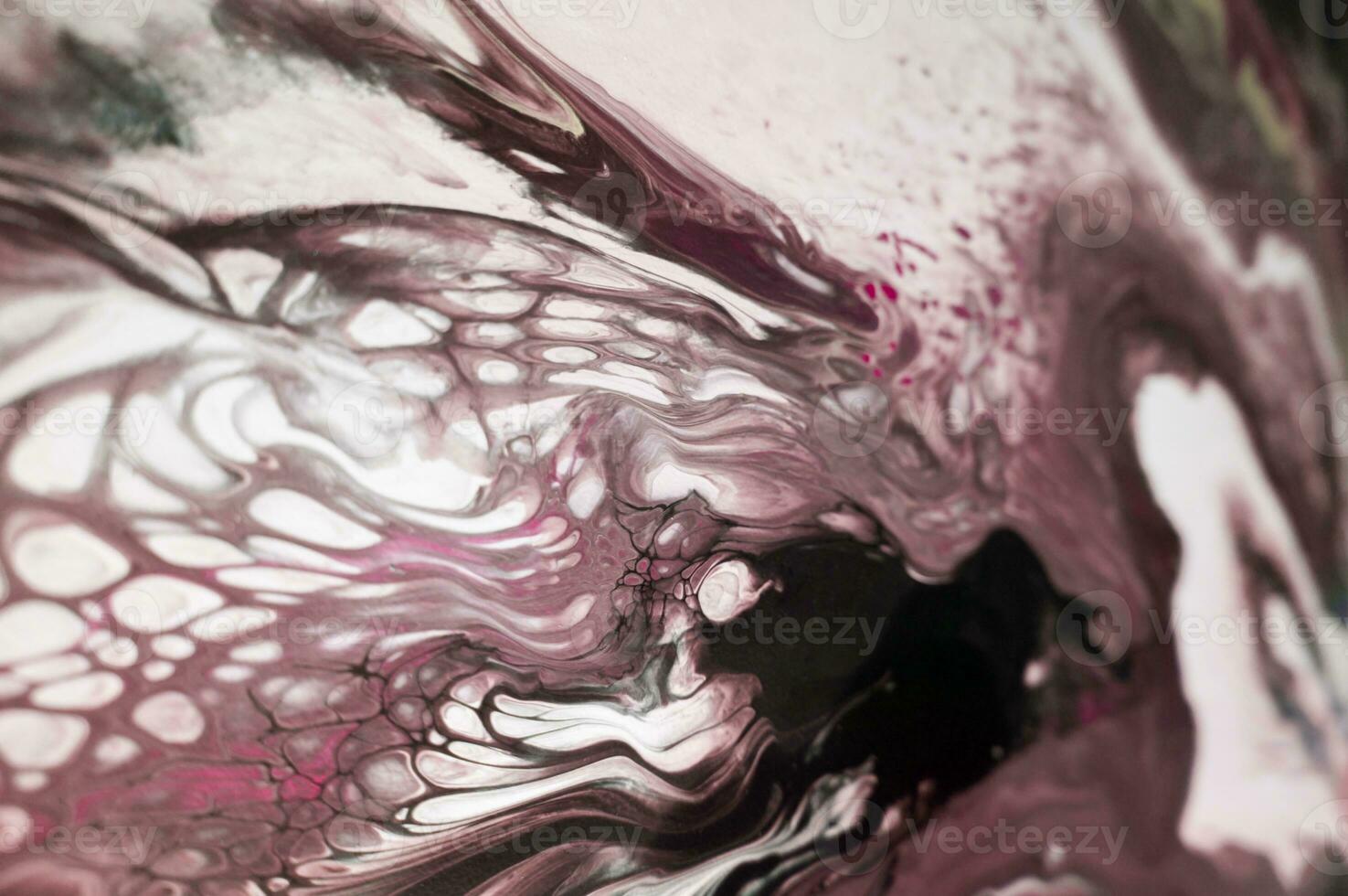 Abstract created using the technique of liquid acrylic. Macro photography of the smallest details of a picture. The picture shows how overflows of shades and colors of paint resemble space motifs. photo