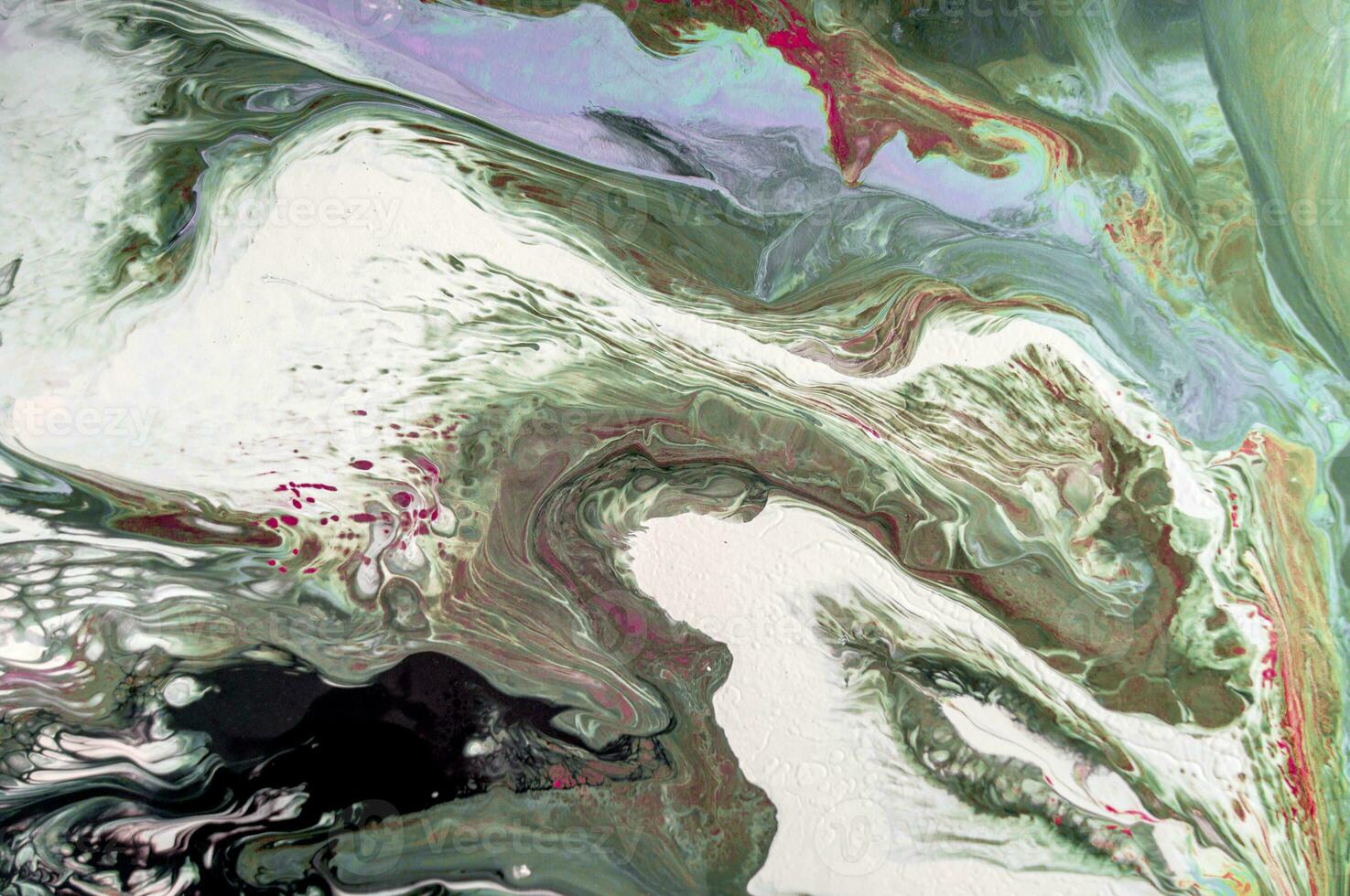 Abstract created using the technique of liquid acrylic. Macro photography of the smallest details of a picture. The picture shows how overflows of shades and colors of paint resemble space motifs. photo