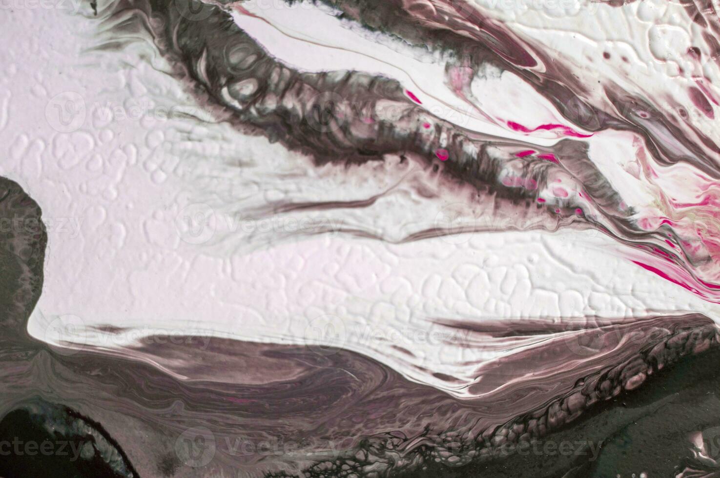 Abstract created using the technique of liquid acrylic. Macro photography of the smallest details of a picture. The picture shows how overflows of shades and colors of paint resemble space motifs. photo