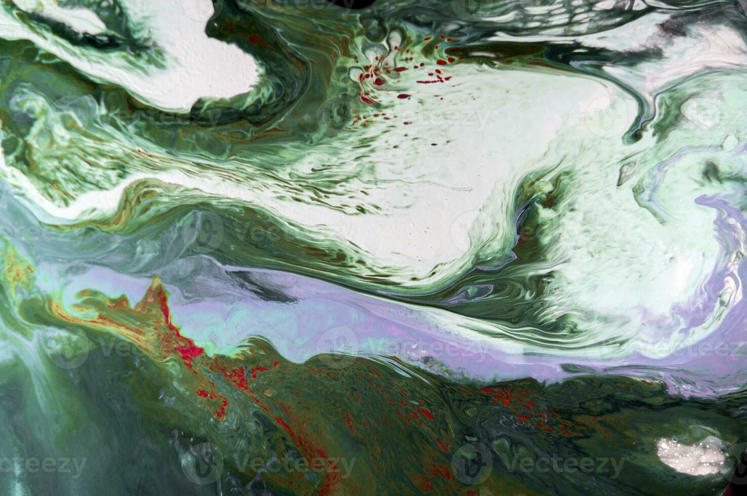 Abstract created using the technique of liquid acrylic. Macro photography of the smallest details of a picture. The picture shows how overflows of shades and colors of paint resemble space motifs. photo