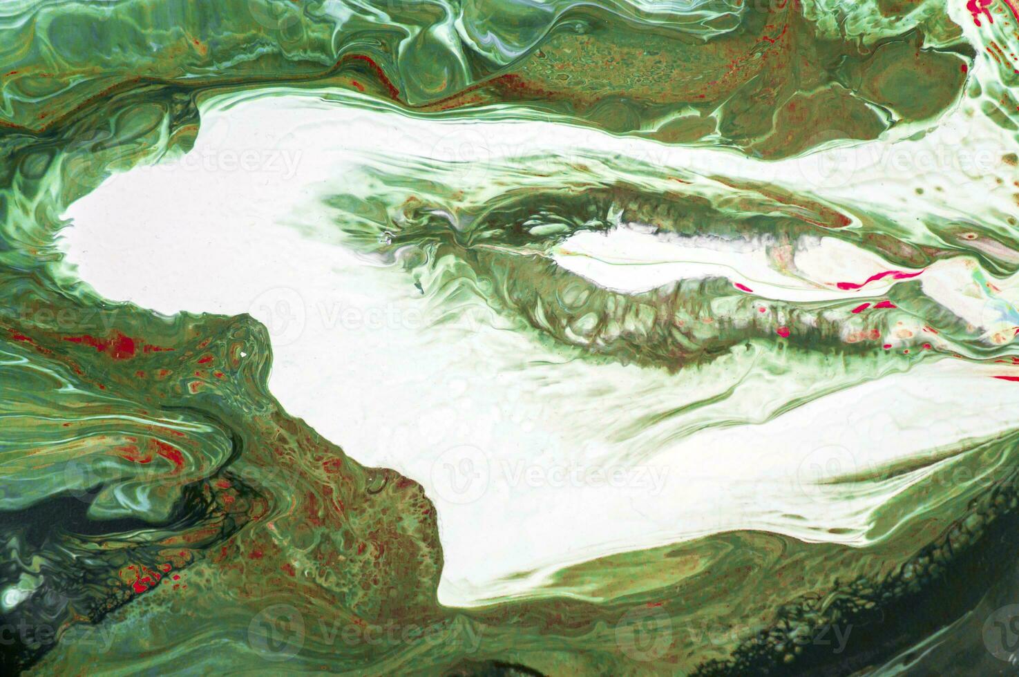Abstract created using the technique of liquid acrylic. Macro photography of the smallest details of a picture. The picture shows how overflows of shades and colors of paint resemble space motifs. photo
