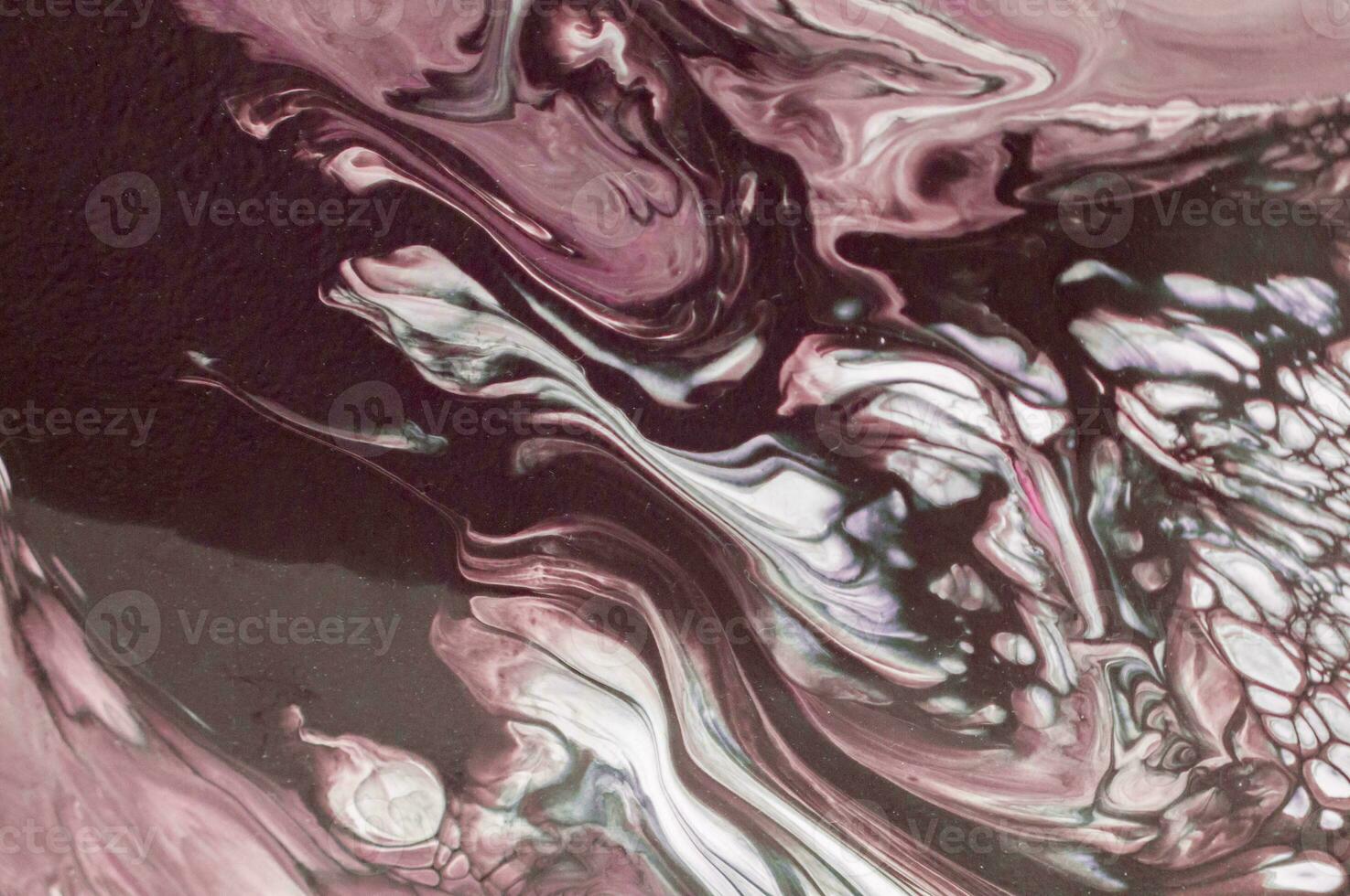 Abstract created using the technique of liquid acrylic. Macro photography of the smallest details of a picture. The picture shows how overflows of shades and colors of paint resemble space motifs. photo